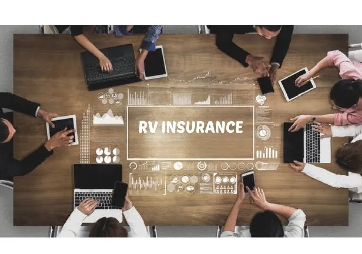 Group of people sitting around a wooden conference table using laptops and tablets, with the words “RV INSURANCE” and digital data graphics overlaid in the center.