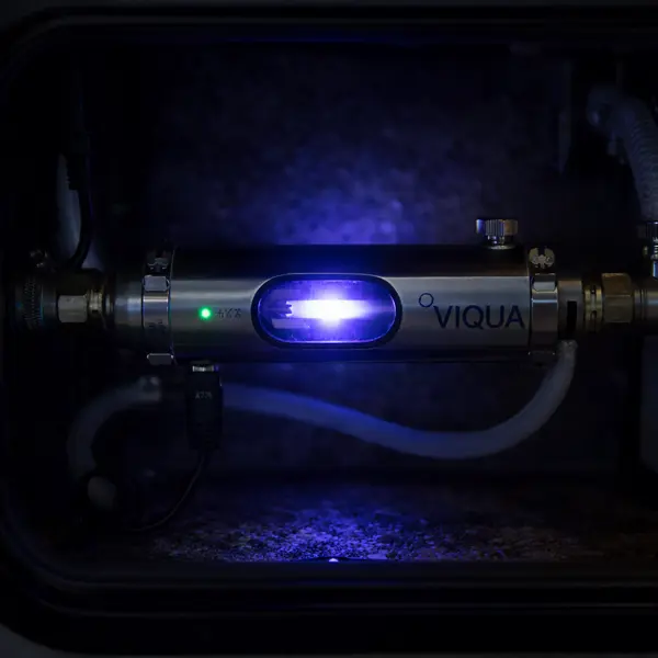 viqua uv water purifier installed in rv showing blue uv light glow killing bacteria and viruses