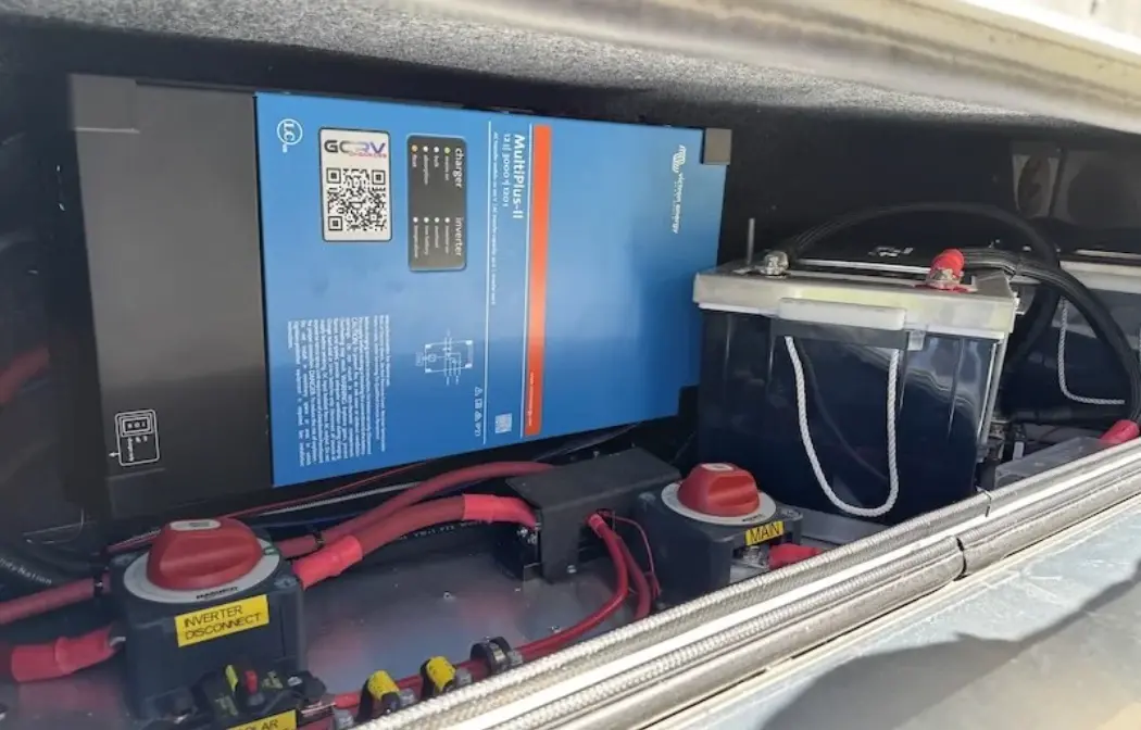 RV battery system setup in van life interior Lithium RV battery setup with inverter and clean wiring inside a camper van